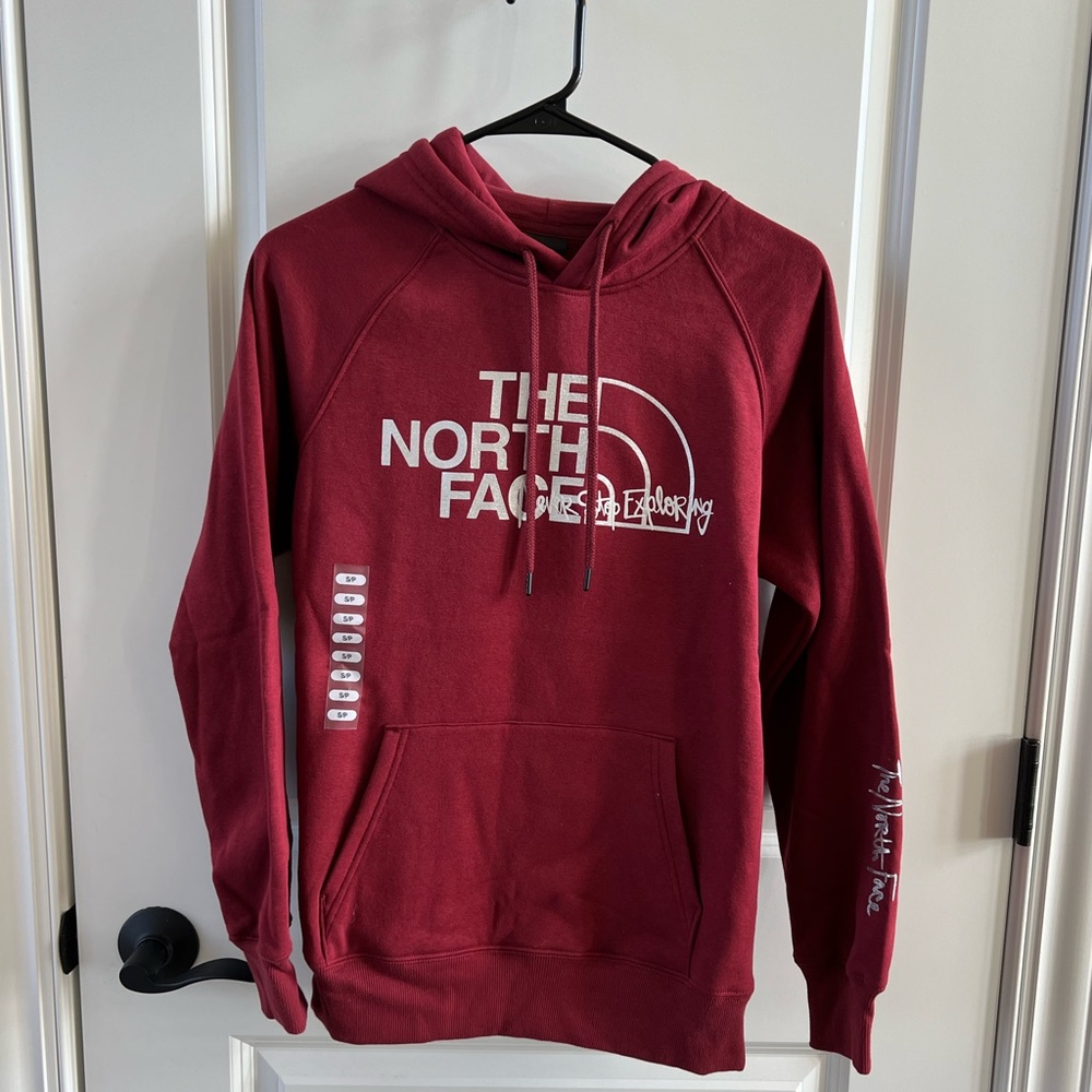 The North Face maroon hoodie.  Brand new with tags. Size small